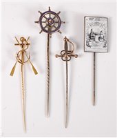 Lot 2544 - Four stick pins: an anchor and oars stick pin,...