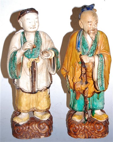 Lot 1 - A Chinese terracotta figure of a sage in...