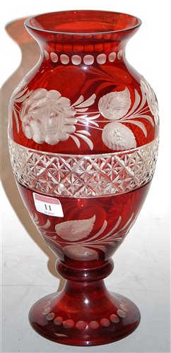 Lot 11 - A Bohemian style ruby overlaid glass vase, of...