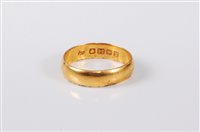 Lot 418 - A 22ct gold wedding band, 5mm wide, hallmarked...