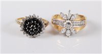 Lot 425 - A 9ct gold black and white diamond cluster...