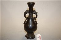 Lot 43 - A Chinese bronze vase, having flared rim to a...