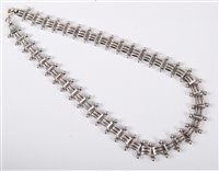 Lot 444 - A silver necklace, the square links with...