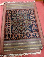 Lot 1198 - A Persian woollen blue ground rug having kilim...