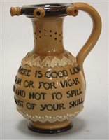 Lot 201 - A Doulton Lambeth puzzle jug, with four line...