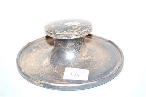 Lot 248 - A silver capstan inkwell, on loaded base,...