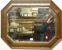 Lot 1144 - A 1920s oak framed bevelled octagonal wall...