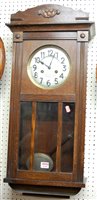 Lot 1147 - A 1930s oak droptrunk wall clock