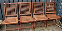 Lot 1161 - A set of four contemporary teak folding garden...