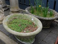 Lot 1162 - A pair of reconstituted stone oval planters, w....