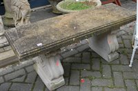 Lot 1168 - A reconstituted stone garden seat, the plain...