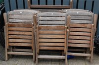 Lot 1174 - A contemporary faded and slatted teak folding...