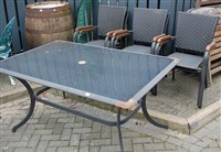 Lot 1175 - A metal and glass inset garden table, length...