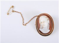 Lot 455 - An oval shell cameo of a lady with upswept...