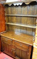 Lot 1189 - A contemporary joined oak dresser, having two...