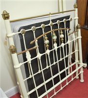 Lot 1212 - A Victorian cream painted wrought iron and...