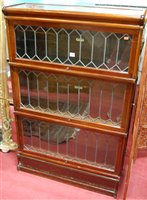 Lot 1225 - A 1920s Globe Wernicke mahogany three tier...