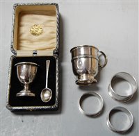 Lot 262 - A cased silver christening set, comprising egg...
