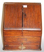 Lot 115 - An Edwardian oak table top stationery cabinet,...