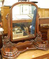 Lot 1245 - A mid-Victorian mahogany swing mirrorback...