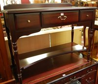 Lot 1274 - A contemporary mahogany ledgeback three drawer...