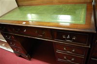 Lot 1294 - A reproduction mahogany and gilt tooled green...