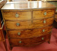 Lot 1302 - A Regency mahogany bowfront chest of two short...