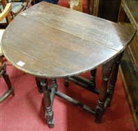 Lot 1315 - An antique oak dropleaf table, having gateleg...