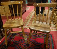 Lot 1326 - A near-pair of early 20th century elm seat and...