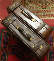 Lot 1327 - A pair of 1970s tan leather suitcases, with...