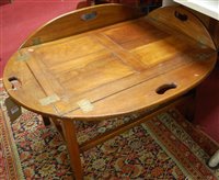 Lot 1330 - A reproduction mahogany butlers tray table,...