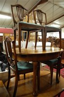 Lot 1338 - An early 20th century walnut D-end extending...