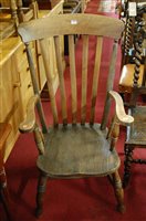 Lot 1430 - An early 20th century elm seat and beech...