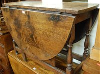 Lot 1438 - An 18th century joined oak drop leaf dining...