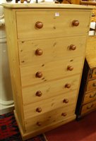 Lot 1458 - A tall modern pine round cornered chest of six...