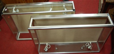 Lot 498 - Two aluminium retailers table-top glazed...