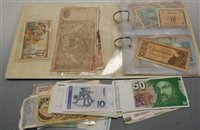 Lot 591 - An album of assorted world bank notes to...