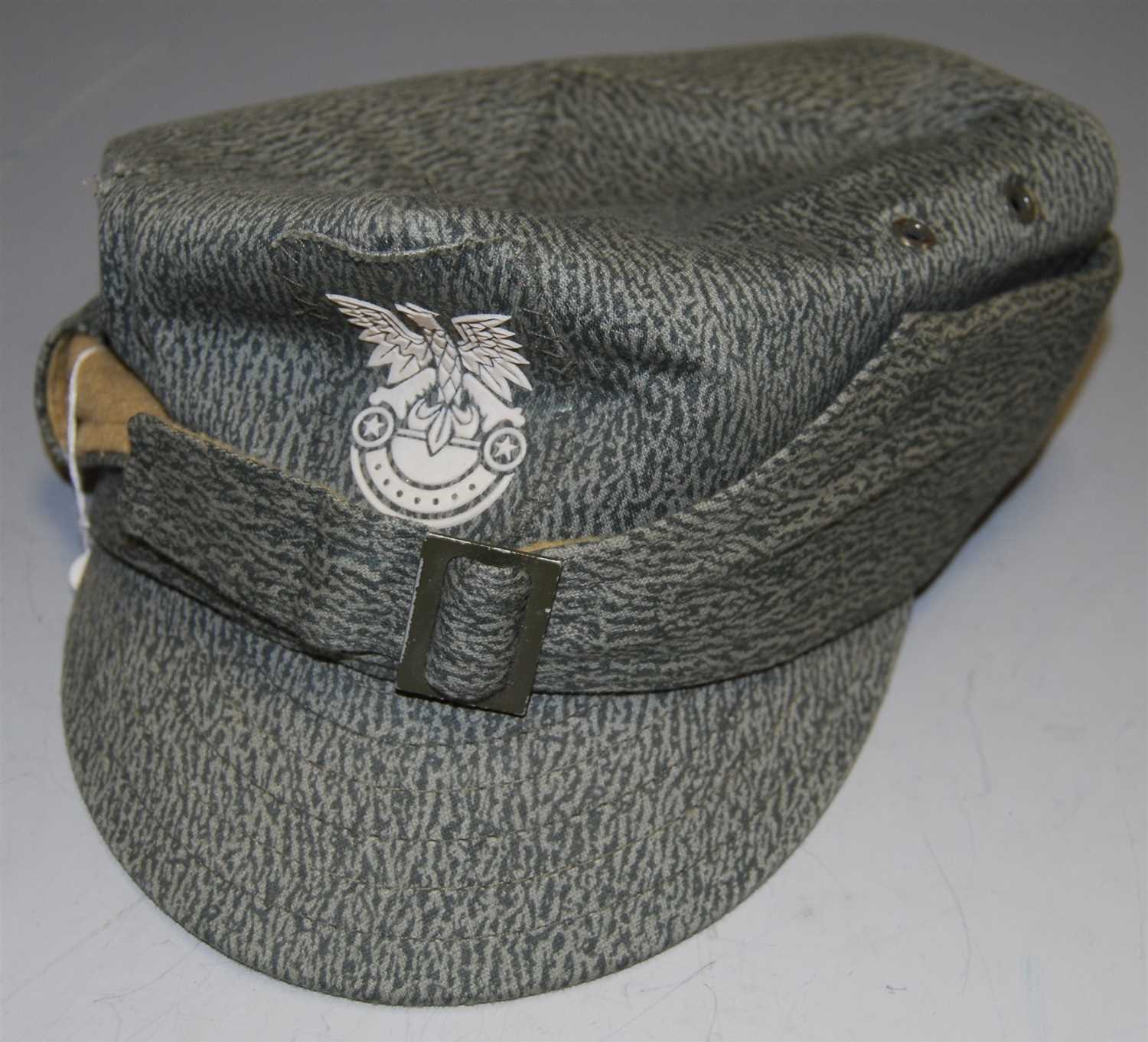 Lot 464 - A reproduction German military style cap