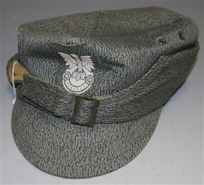 Lot 464 - A reproduction German military style cap