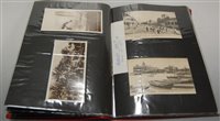 Lot 595 - An album of photographs and postcards to...