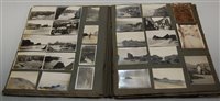 Lot 602 - An early 20th century photograph album and...