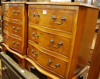 Lot 1481 - A pair of reproduction yew wood serpentine...