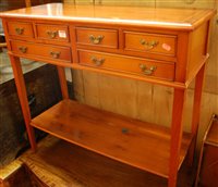 Lot 1492 - A reproduction yew wood two-tier side table,...