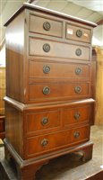 Lot 1495 - A small reproduction mahogany bedside tallboy,...