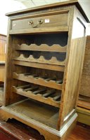 Lot 1498 - A contemporary oak freestanding wine rack,...