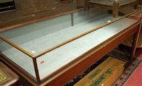 Lot 1504 - A circa 1900 mahogany and glazed long shop...