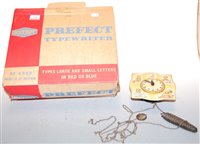 Lot 613 - A boxed Mettoy tin plate Perfect typewriter,...