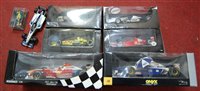 Lot 734 - A box of various cased diecast Formula 1 cars,...