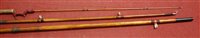 Lot 737 - An early 20th century split cane fishing rod,...