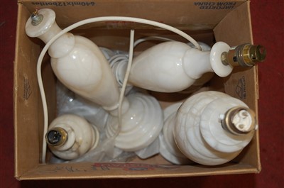 Lot 565 - A collection of five white marble table lamps